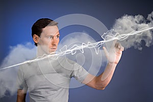 Man making magic effect - flash lightning. The concept of electricity, high energy.