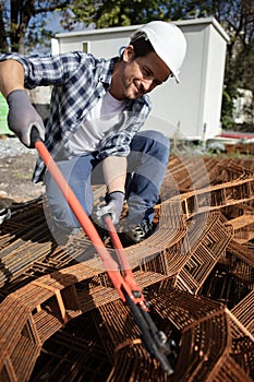 man making net steel bars