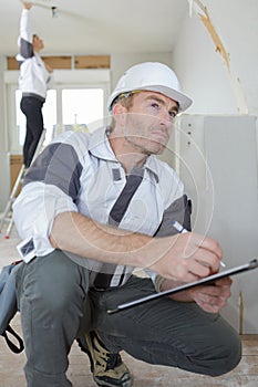 Man making notes on renovation project