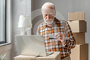 Man making online purchase with credit