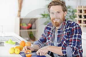 Man making orange juice