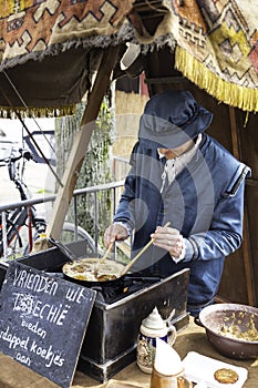 man making pancackes in traditional costume in den briel