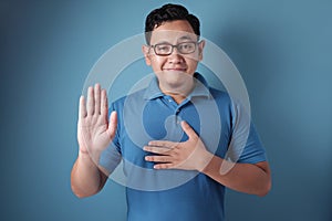 Man Making Pledge Gesture, Hand on Chest, Making Promise photo