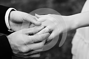 Man making proposal with the ring to his girlfriend. Put ring on