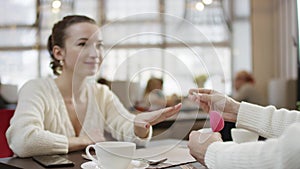 Man making a proposal to his girlfriend in restaurant