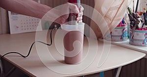 Man making a protein shake at home