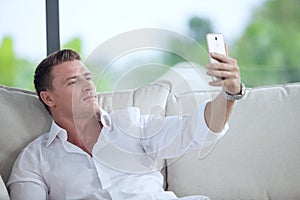 Man making self photo with his mobile phone