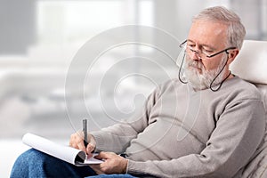 Man making the shopping list for holidays