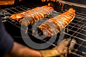 Man making smoked salmon on fire