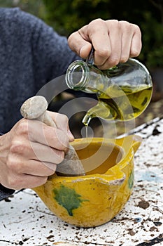Man making some aioli in a mortar photo