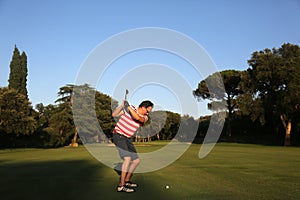 Man making swing in the golf course