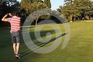 Man making swing in the golf course