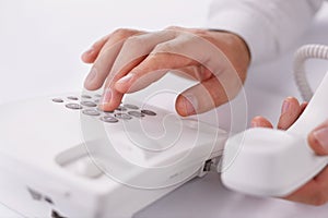 Man making a telephone call on a landline