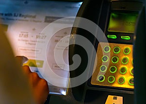 Man making a travel booking in a kiosk