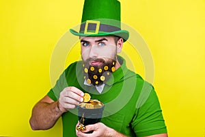Man male in green costume of leprechaun celebrating Saint Patrick`s Day