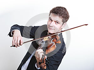 Man man dressed elegantly playing violin