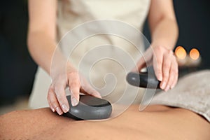 Man man receiving hot stone massage