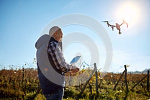 Man manage drone at sky