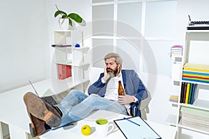 Man manager businessman worked successfully and at the end of the day, drinks beer. Depressed upset man drinker addicted