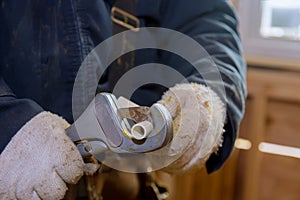 Man manual cuts off a piece of polypropylene pipes for installation water line