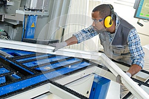 Man manufacturing upvc frame photo
