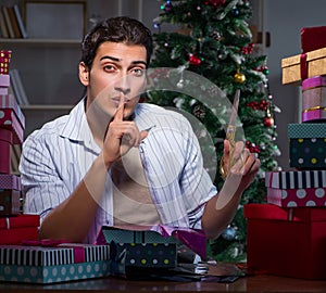 Man with many christmas gifts in boxes