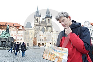 Man with map over tourist attraction