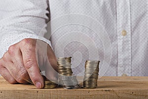 Man mashing stacking euro coins