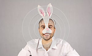 Man in the mask Easter rabbit looking at camera and smile