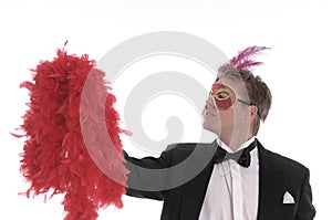 Man with mask and feather boa