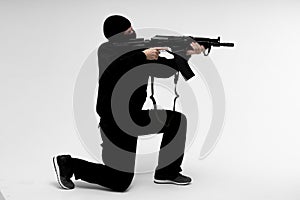 Man in mask With gun on white background