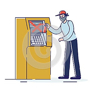 Man in mask painting on atm machine. Street vandal and vandalism concept