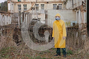 Man with mask and protective clothes explores danger area r