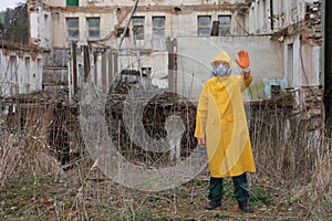 Man with mask and protective clothes explores danger area r