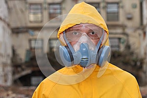 Man with mask and protective clothes explores danger area r