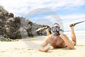 Man with mask for snorkling at the seaside beach