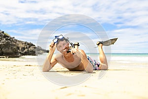 Man with mask for snorkling at the seaside beach