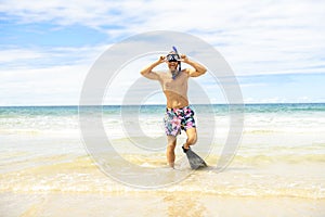 Man with mask for snorkling at the seaside beach