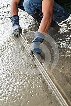 Man mason building a screed coat cement