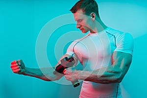 Man with massage percussion device