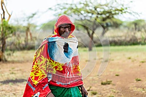 Massai man standing in the rain photo