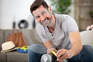 man measures hand luggage for comply low cost airlines restrictions