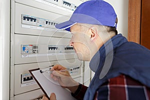 Man measuring electrical current