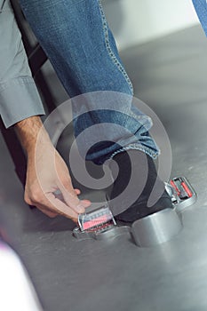 man measuring his feet