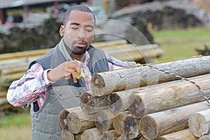 man measuring posts