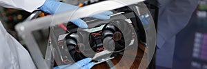 Man mechanic installing cooler fan with copper tubes on computer processor