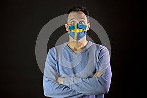 Man in medical mask. Isolated. Coronavirus outbreak in Sweden. Global pandemic