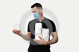 Man with a medical mask and toilet paper on an isolated white background