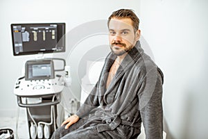 Man at the medical office with ultarsound diagnostics