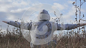 A man meditates in nature, a man prays and looks into the sky and into the clouds, a guy in a sweatshirt with a hood does yoga